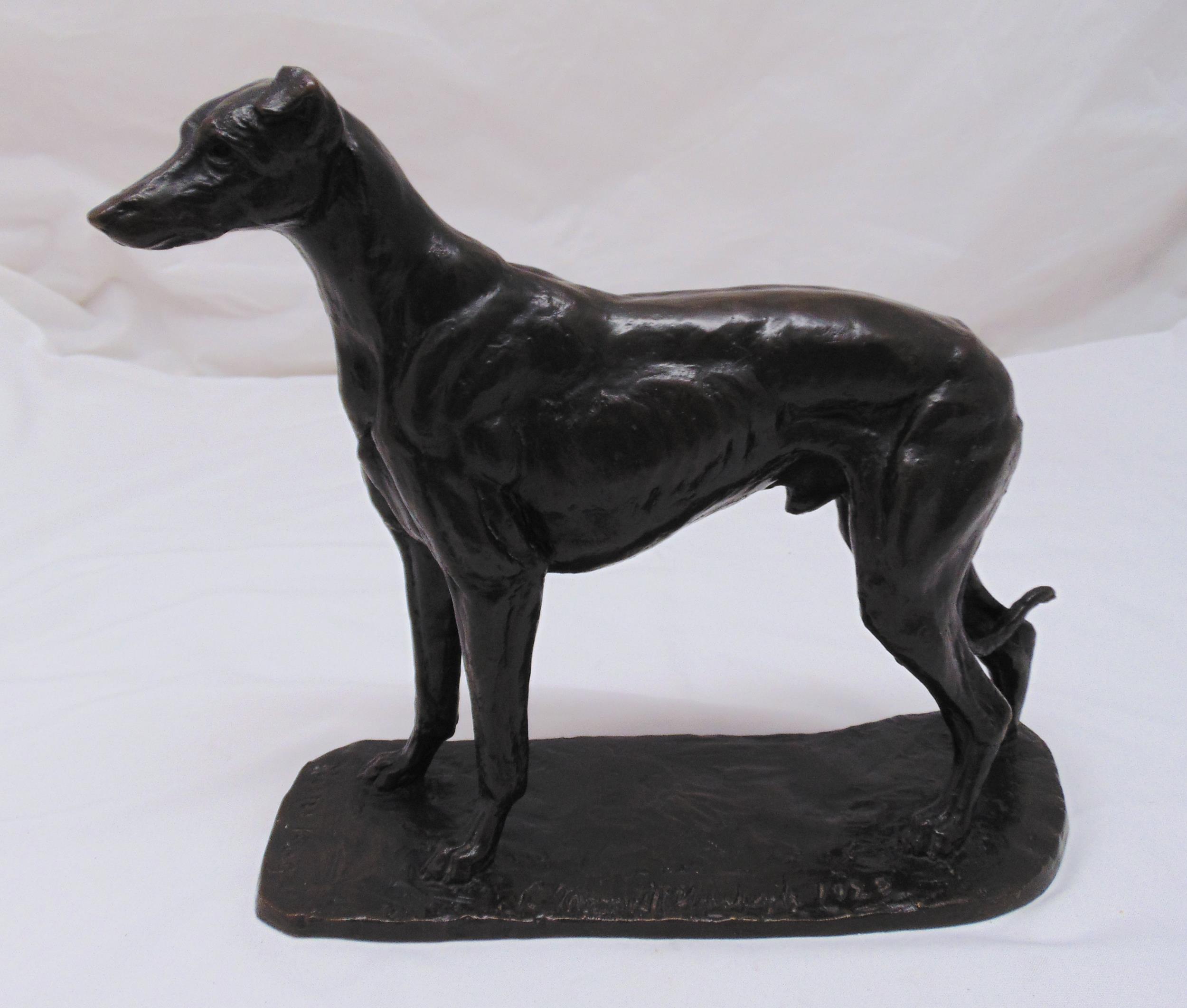 A bronze figurine of a greyhound titled Moon King indistinctly signed and dated 1922, 31.5 x 37 x