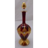 A Murano red glass decanter with applied coloured stones and gilded decoration with drop stopper