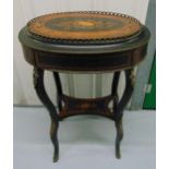 A late 19th century ebonised wooden jardinière of oval form