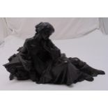 A cast bronze figurine of a recumbent classical lady, 24 x 45 x 12cm