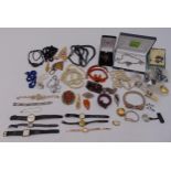 A quantity of costume jewellery to include necklaces, brooches and watches