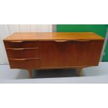 A mid 20th century McIntosh rectangular teak sideboard with cupboards and three drawers on