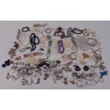 A quantity of silver and costume jewellery to include rings, necklaces, bracelets, earrings and