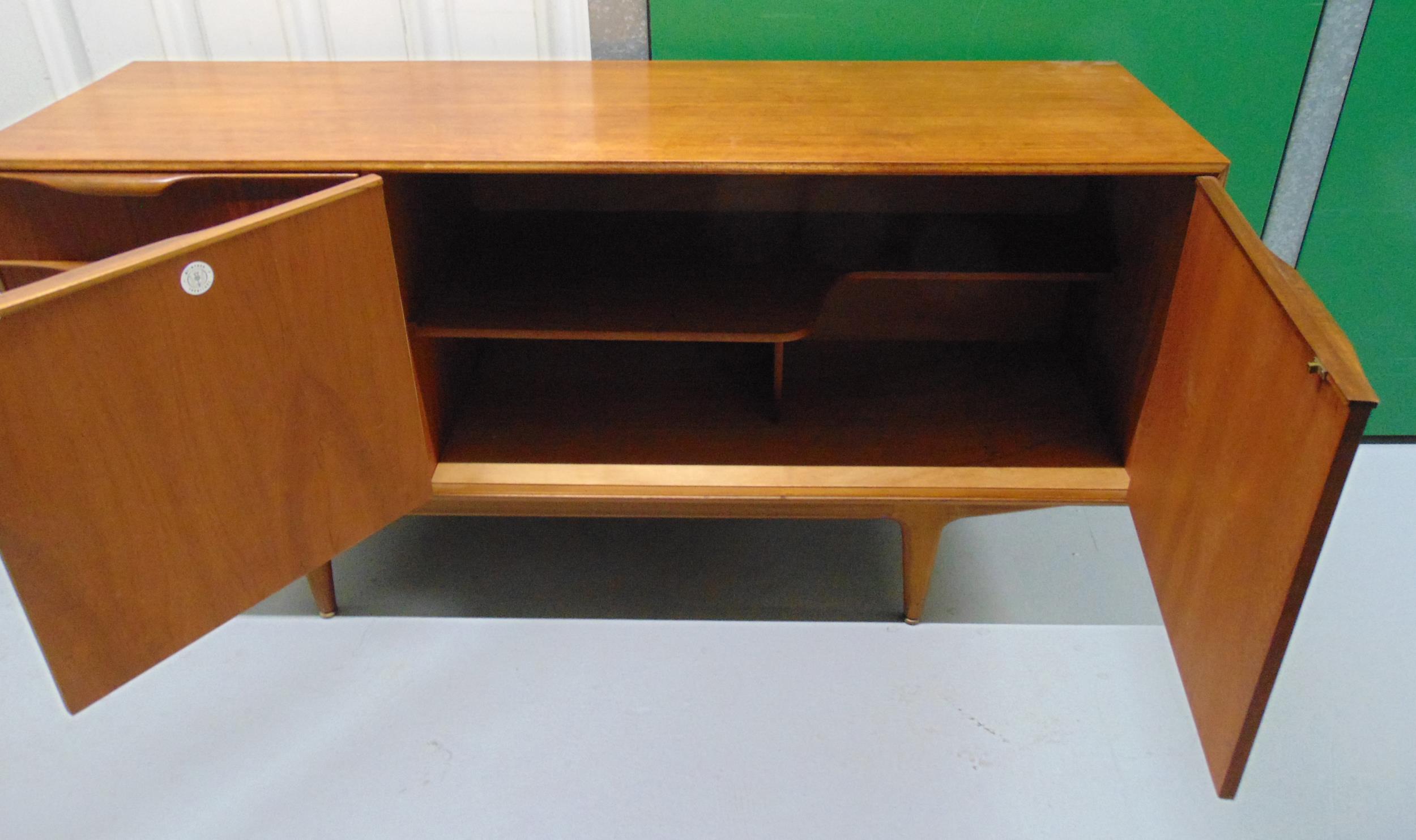 A mid 20th century McIntosh rectangular teak sideboard with cupboards and three drawers on - Image 2 of 4