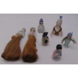 Seven porcelain half dolls, two with original brushes and a bell