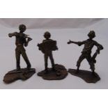 A set of three cast bronze miniature figurines of musicians on naturalistic bases, tallest 9cm (h)