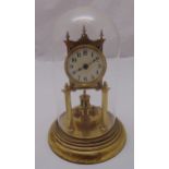 An Anniversary gilt metal skeleton clock, white enamel dial with Arabic numerals to include glass
