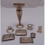 A quantity of silver to include cigarette cases, a card case, a vase, condiments and an inkwell (8)