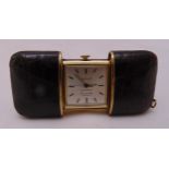 Chalet shaped rectangular leather mounted travel clock, the retractable sliding case with suspensory