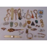 A quantity of costume jewellery to include brooches, necklaces, earrings and watches