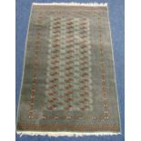 A Persian wool carpet blue ground with geometric repeating pattern and border, 175 x 130cm