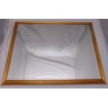 A rectangular gilded wooden framed wall mirror, 84.5 x 110cm