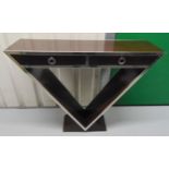 An Art Deco style consol table of triangular form, two drawers with ring handles on raised