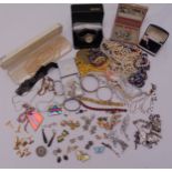 A quantity of costume jewellery to include necklaces, brooches, rings, cufflinks and watches