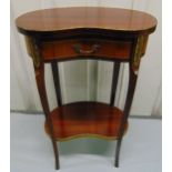 A mahogany kidney shaped side table with gilded metal mounts, a single drawer on four cabriole legs,