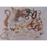 A quantity of silver and costume jewellery to include necklaces, earrings, bracelets and brooches