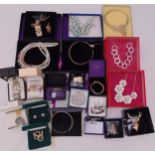 A quantity of silver and costume jewellery to include necklaces, earrings, bracelets, brooches and