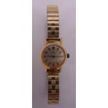 Omega gold plated ladies wristwatch on an expanding bracelet