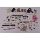 A quantity of costume jewellery to include necklaces, brooches, rings and bracelets