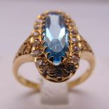 18ct yellow gold, blue topaz and diamond cocktail ring, approx total weight 5.1g