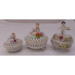 Three Schierholz porcelain circular pot pourri dishes and covers decorated with flowers and putti