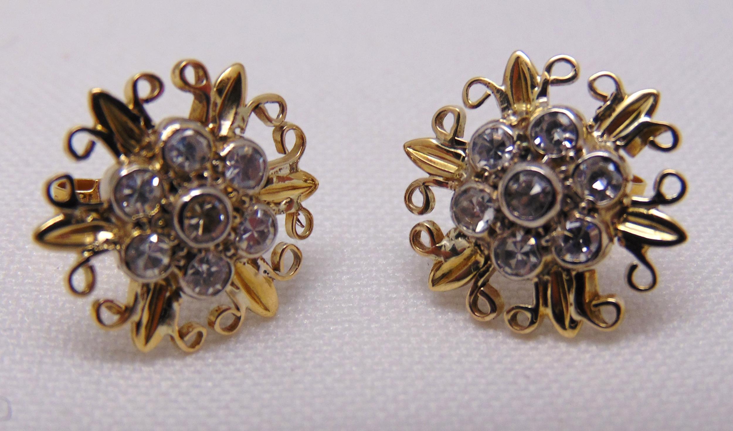 A pair of yellow gold and white stone floral shaped earrings, tested 9ct, approx total weight 3.6g