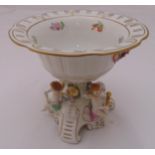 Schierholz porcelain table centre piece on raised triform base decorated with putti and painted