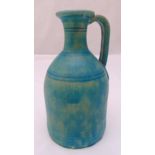 A Persian 12th century ceramic flagon, turquoise crackle glaze with loop handle, 28cm (h)