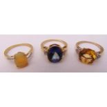 Three 9ct gold rings set with coloured stones, approx total weight 6.6g
