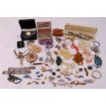 A quantity of costume jewellery to include necklaces, brooches, cuff links and a watch