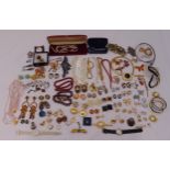 A quantity of costume jewellery to include wristwatches, bangles, brooches and earrings