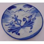 A Chinese 19th century blue and white charger decorated with a heron and symbols, 36cm dia