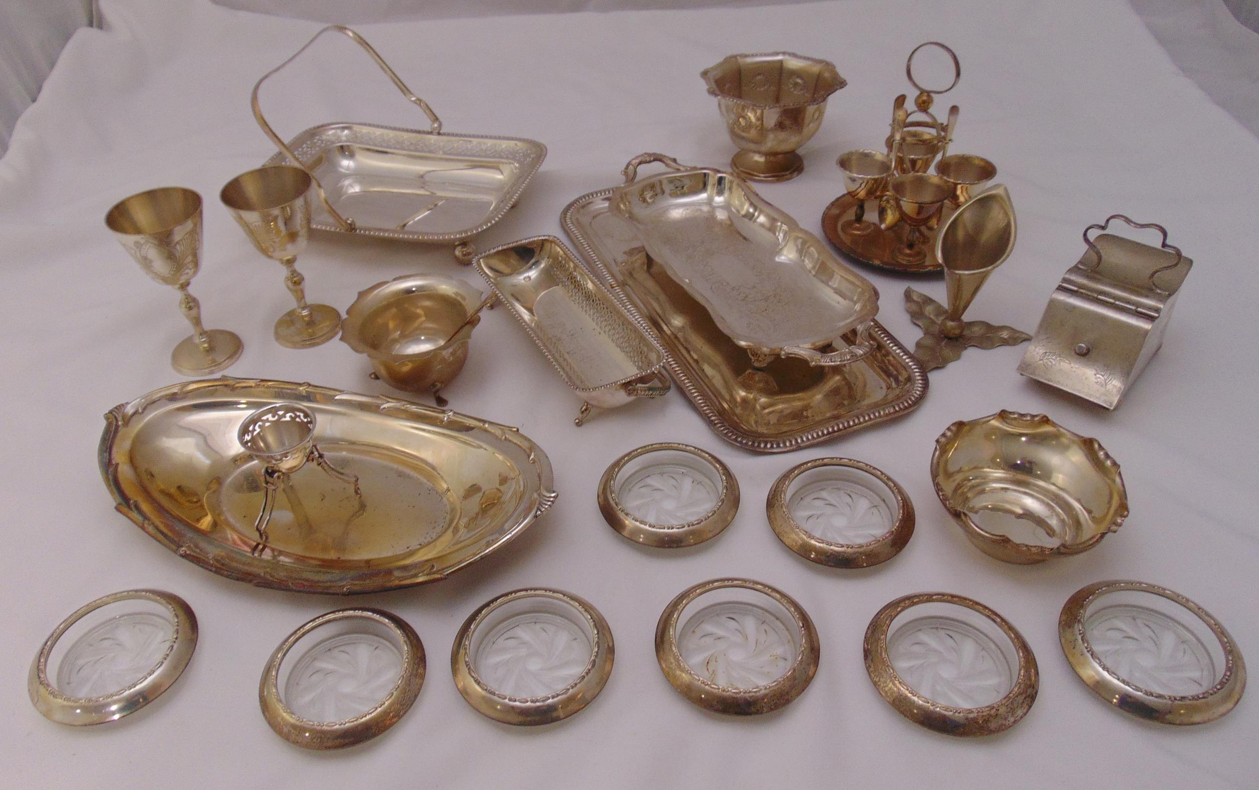 A quantity of silver plate to include dishes, coasters and eggcups on a stand