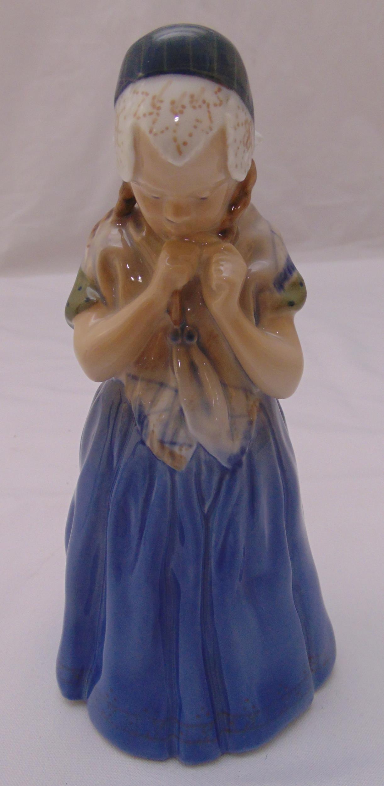 Royal Copenhagen figurine of a girl holding her ponytail 1323, marks to the base, 21cm (h)