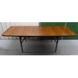 A mid 20th century Rosewood rectangular dining table with one drop in leaf and six matching