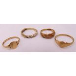 Four 9ct yellow gold rings, approx total weight 4.9g