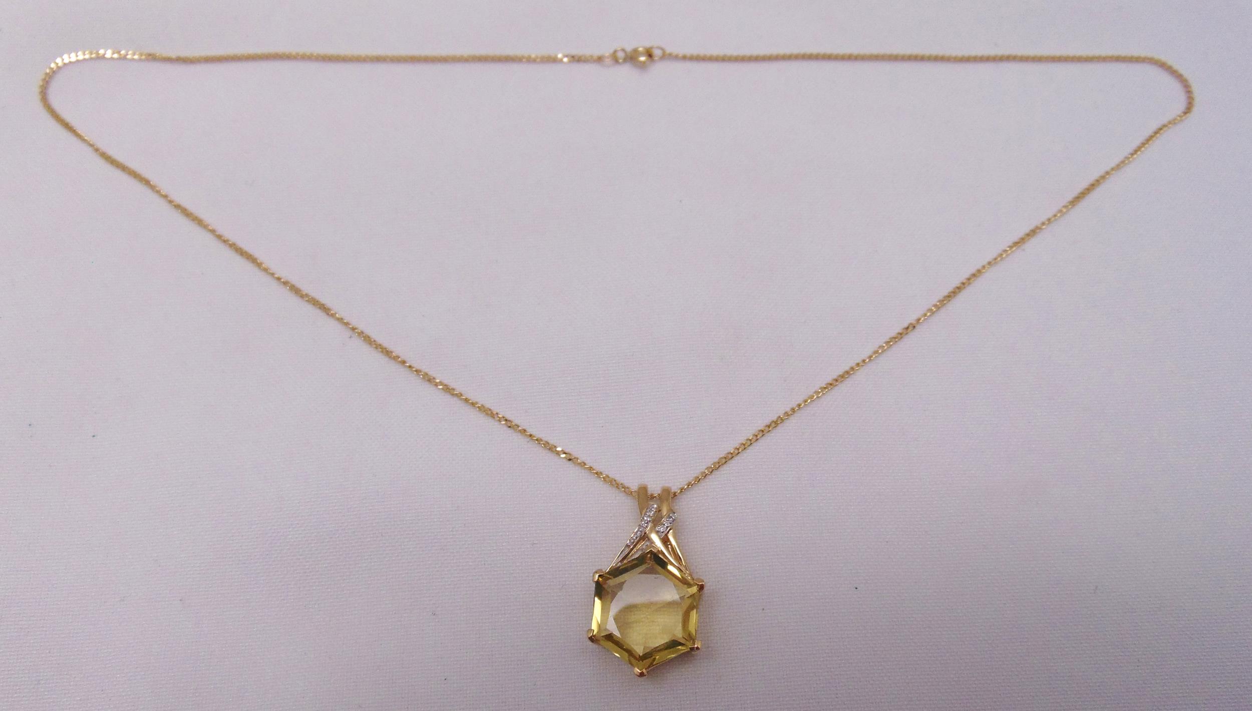 9ct gold citrine and diamond pendant on a 9ct gold chain, approx total weight 8.9g