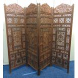 An oriental four panel wooden carved and pierced screen, each panel 173 x 52 x 2cm