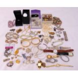 A quantity of costume jewellery to include necklaces, bracelets, earrings, brooches, rings, pendants