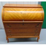 A continental mahogany and satin wood rectangular roll top desk with three drawers, brass scroll
