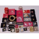 A quantity of costume jewellery to include brooches, a watch, a necklace and collectables