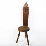 A carved wood miniature chair with floral design, height 53cm