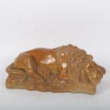 A salt glaze stoneware pottery figural recumbent lion, indistinctly signed, length 20cm