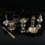 An Elizabeth II silver tea strainer, silver cruets, pepperette etc