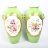 A pair of Cauldon green ground porcelain vases with hand painted botanical panels, signed B