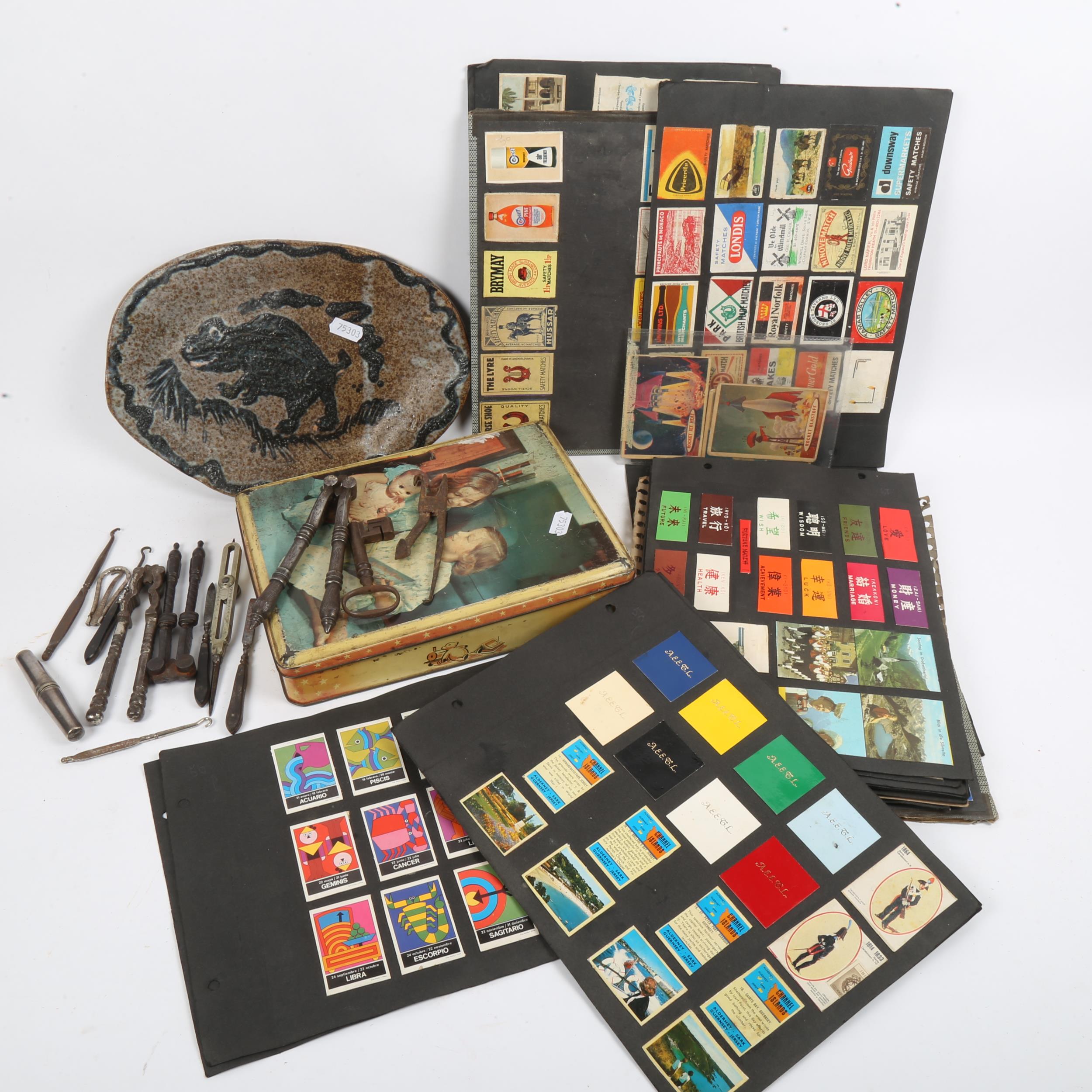 A collection of Vintage matchbox cases, a Studio pottery plate, Antique steel nutcrackers etc