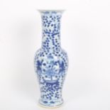 A Chinese blue and white beaker vase, figural and floral decoration with jars, height 31cm