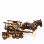 A large ceramic Shire horse with barrel cart