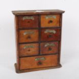 A small oak table-top spice bank of drawers, W22cm, H26cm, D9cm
