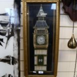 A decorative wall clock in glazed case, height 64cm